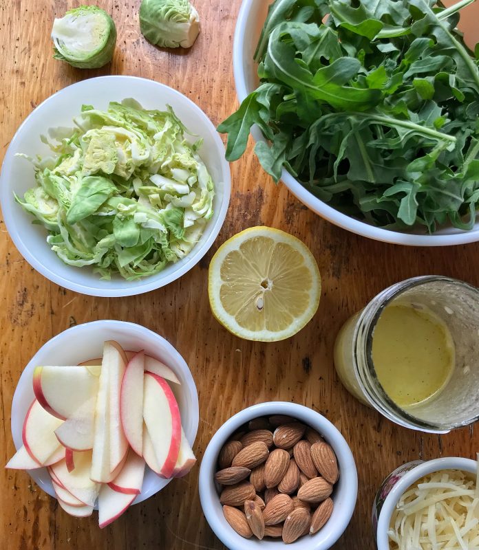 Arugula, Apple & Brussels Sprouts Salad with Lemon Shallot Vinaigrette via LizsHealthyTable.com #salad #vegetarian