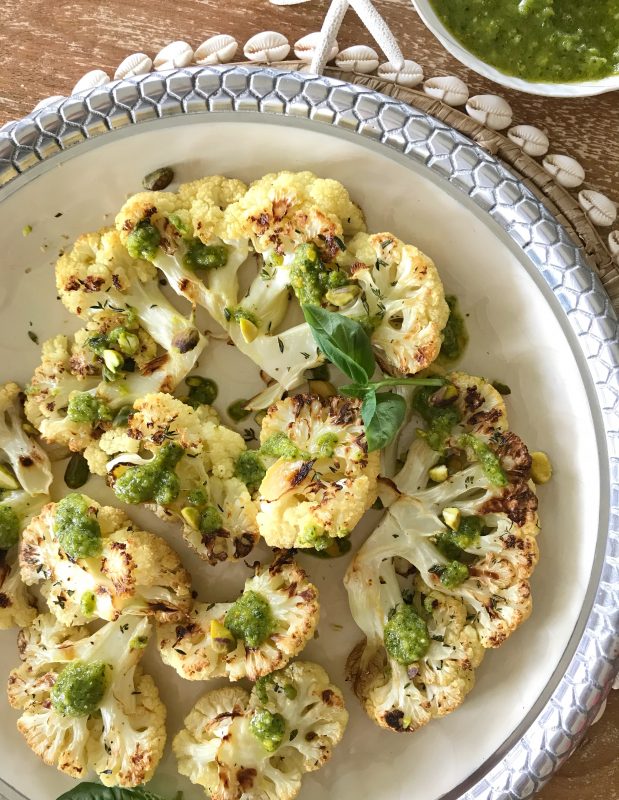 Roasted Cauliflower Steaks with Pistachio Pesto via LizsHealthyTable.com #vegetarian
