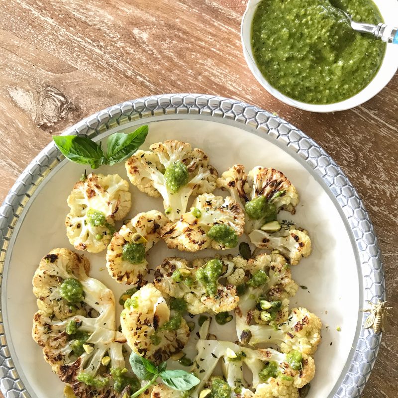 Roasted Cauliflower Steaks with Pistachio Pesto via LizsHealthyTable.com #vegetarian