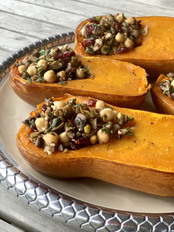 Honeynut Squash Stuffed with Mushrooms, Chickpeas, Pistachios & Cranberries via LizsHealthyTable.com #vegan #vegetarian